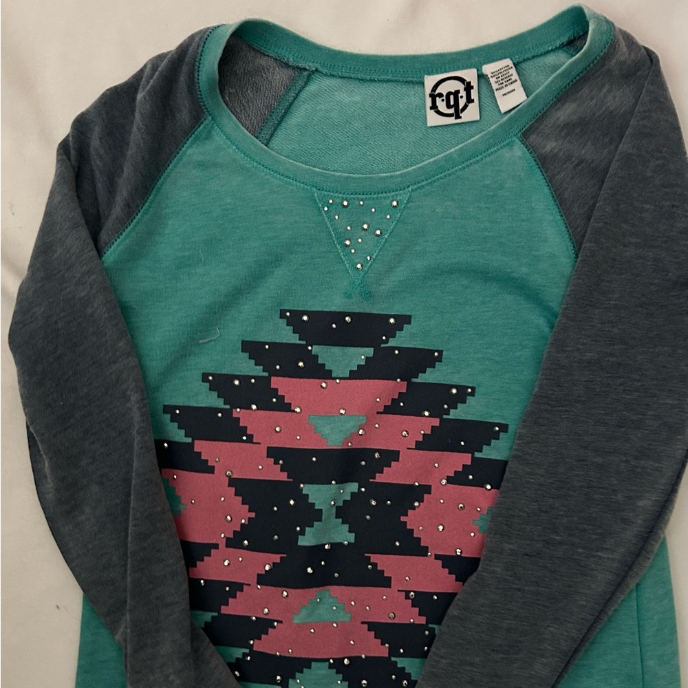 Blue geometric design green top